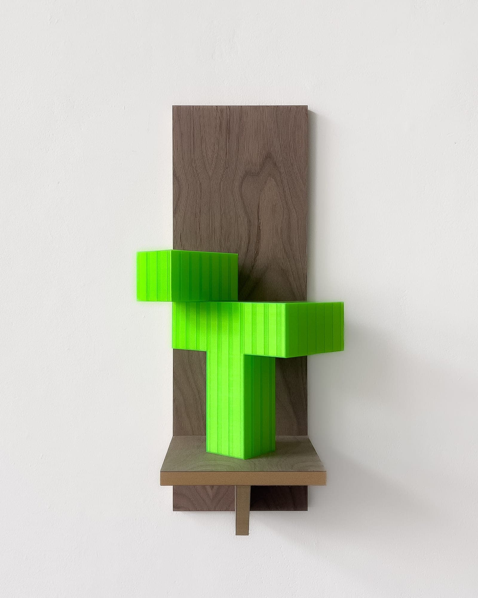 Wall-mounted walnut panel sculpture with a neon-green 3D-printed stepped block form