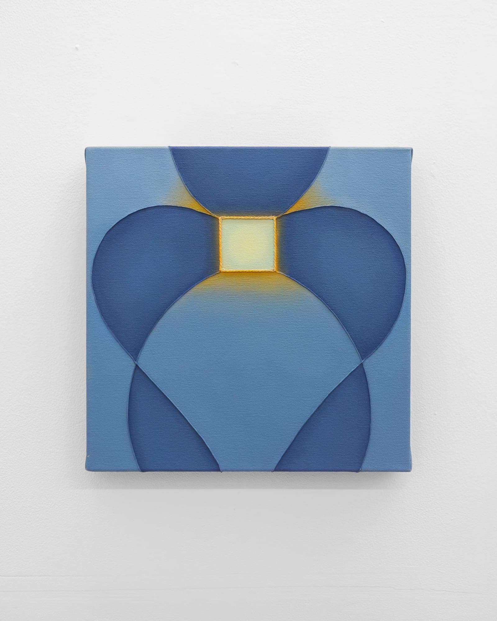 Light blue square painting with four dark navy petal shapes meeting at a small yellow square center