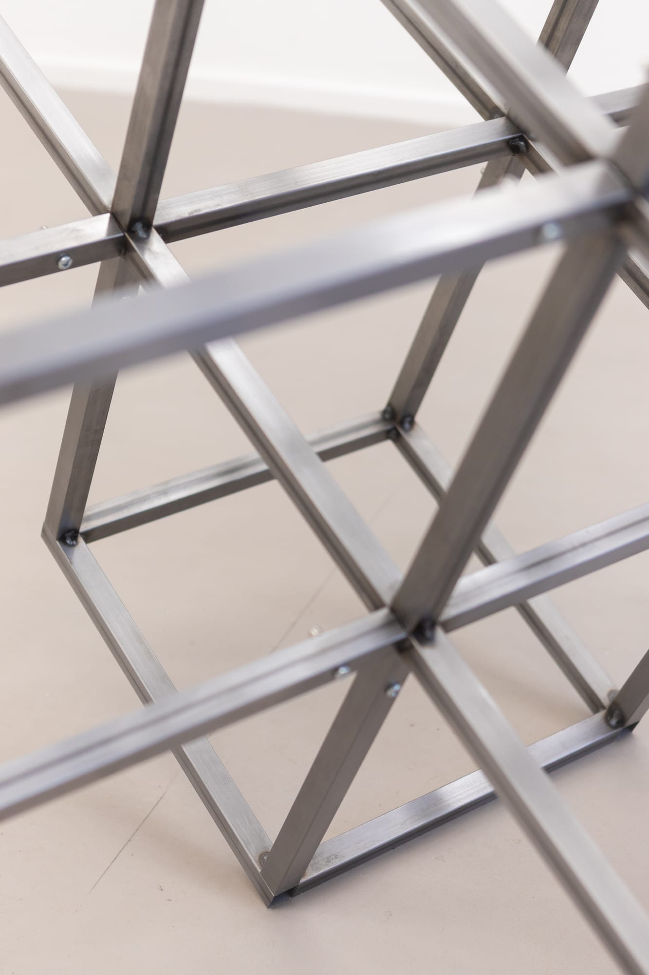 Macro detail of a welded steel cube sculpture
