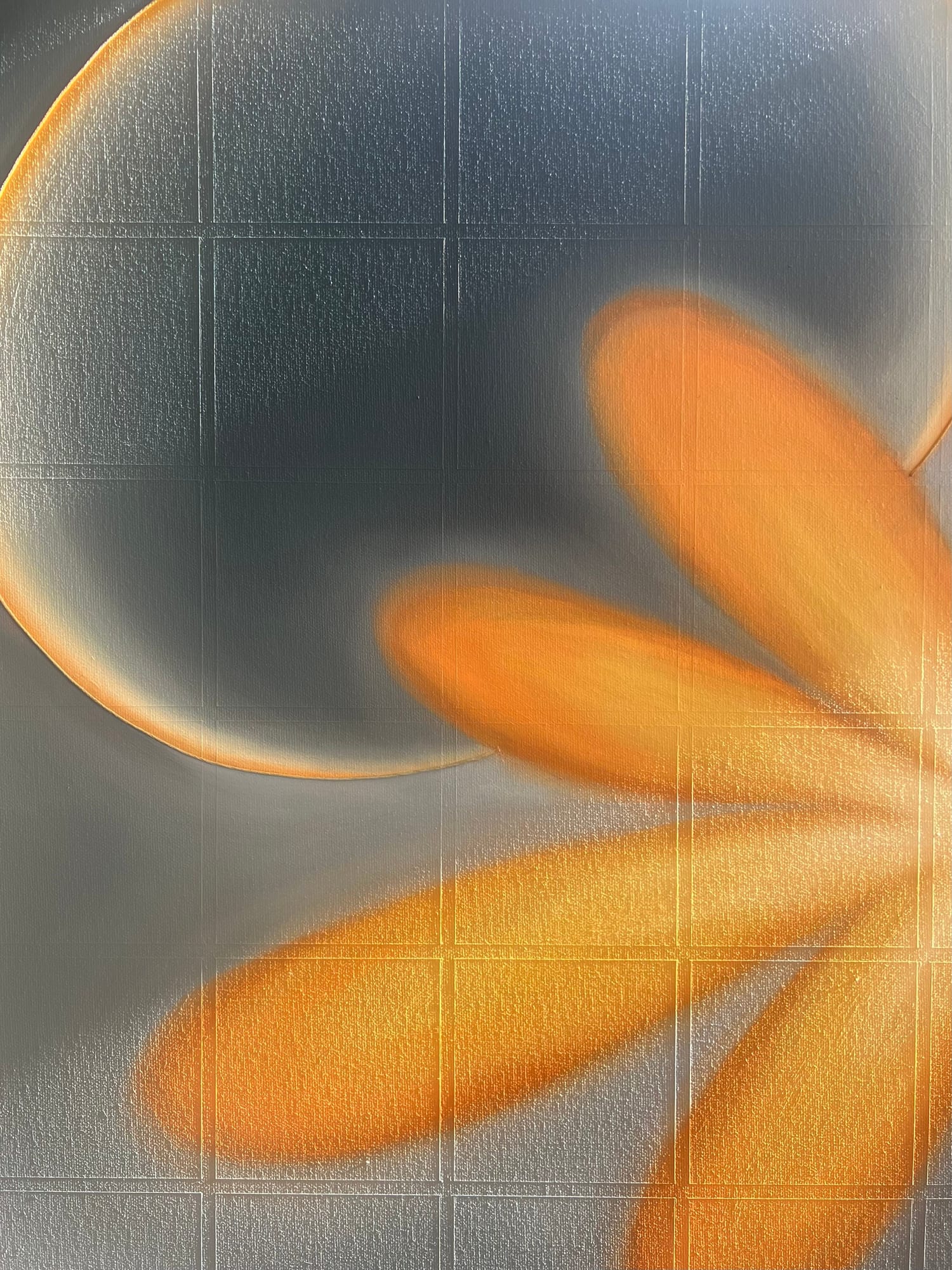 Close-up of a blue-grey painting with orange geometric forms